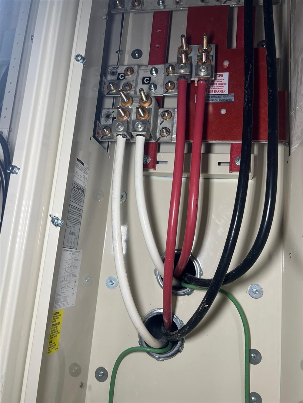 Electrical panel checked for a hot breaker and burning-smell hazard